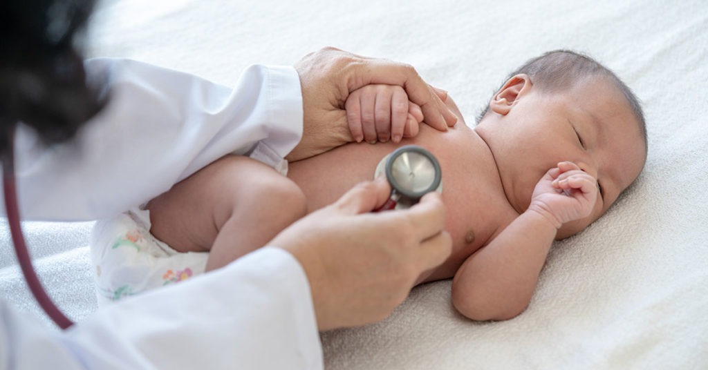 Adorable asian newborn baby girl check up examines by pediatrician doctor. Female doctor hand using stethoscope examining little cute baby infant heart and lung in clinic. Baby health care concept depicting newborn and infant care at Wake Forest Pediatric Associates